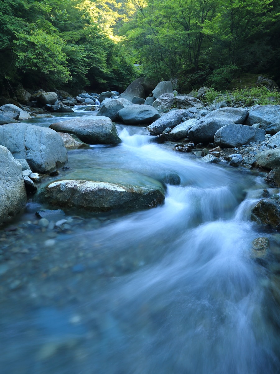 A clear river running over smooth stones